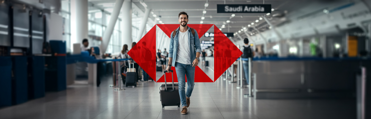 a man wearing a blue denim walking in the airport