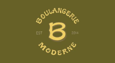 The image shows the Boulangerie Moderne logo. The text is in gold, and the background is green