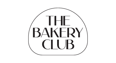 The Bakery Club logo showing the words "The Bakery Club" written in black inside a black circle