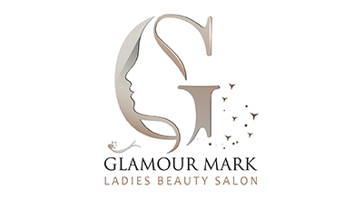 logo for "Glamour Mark Ladies Beauty Salon." The design features a large letter "G," which incorporates the silhouette of a woman's face on the left side. Small butterfly-like elements are scattered to the right of the "G." Below the main design,