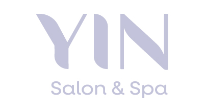 The brand name (YIN) in lavender color and under YIN in small font (salon & spa) in lavender color with white background