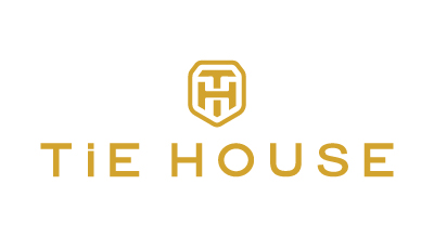 The image shows a logo with the name "TIE HOUSE" written in golden letters. Above the text, there is a stylized emblem that combines the letters "T" and "H" inside a hexagonal shape. The background is white