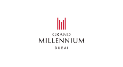 الصورة عبارة عن شعار Grand Millennium مكتوبة باللون الرمادي مع خلفيه بيضاء