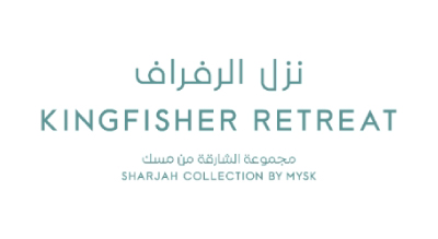 The image shows a logo with the name Kingfisher Retreat" written in green  letters.The background is white
