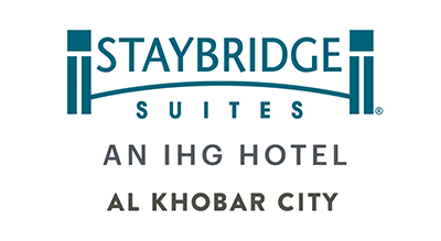 الصورة عبارة عن شعار Staybridge Suites Al Khobar مكتوبة باللون الازرق مع خلفيه ابيض