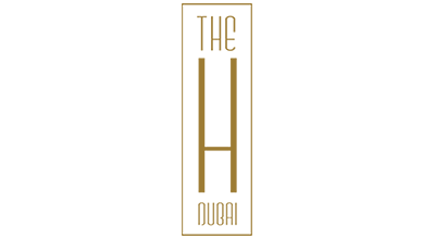 The image shows a logo with the name "The H Hotel " written in gold letters.The background is white