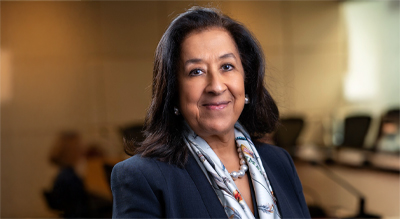 The image shows a Ms. Lubna S. Olayan
