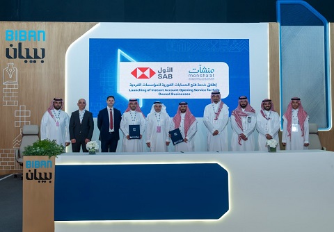 The image shows a large group of men posing for a formal group photo.