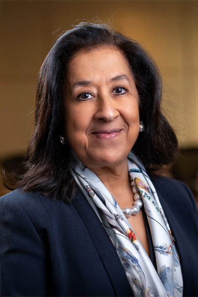 The image shows a Ms. Lubna S. Olayan
